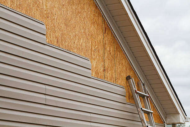Professional Storm Damage Siding Repair technician working in Fort Washington, MD